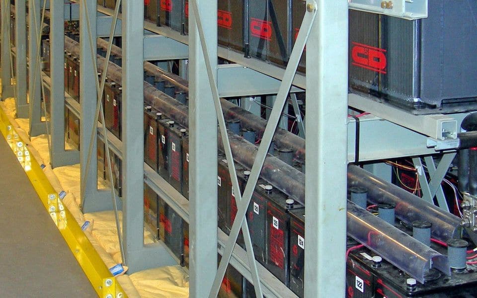 Rows of batteries on steel racks