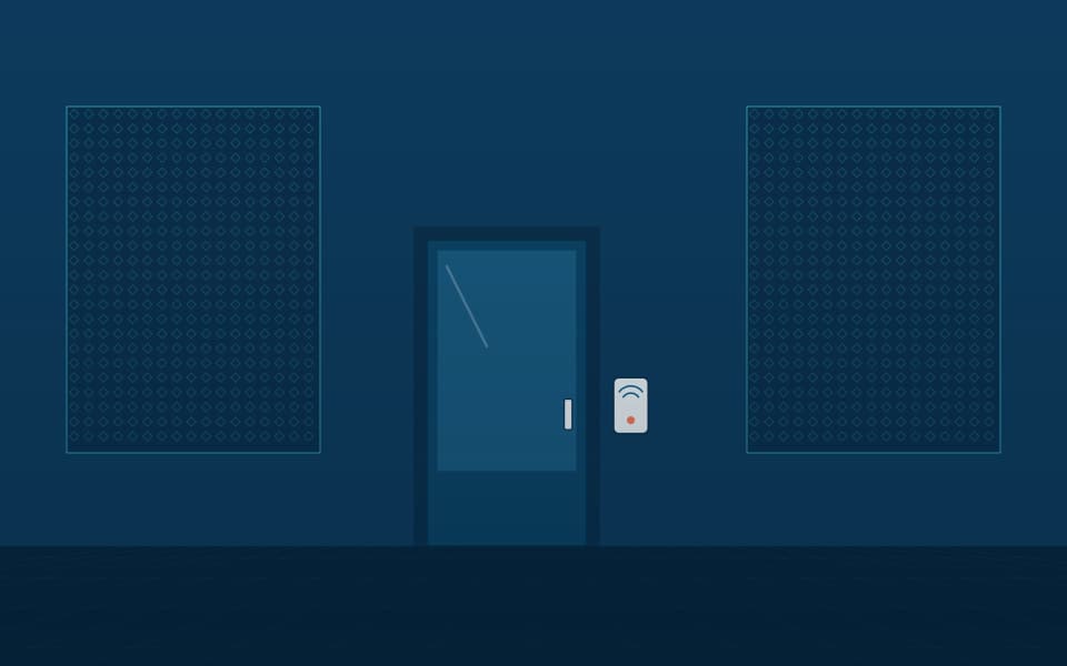 Controlled door with a card reader between screened walls, at night