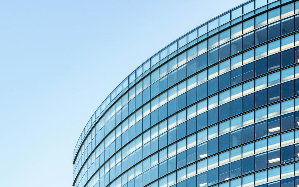 Modern glass-walled commercial office tower facade
