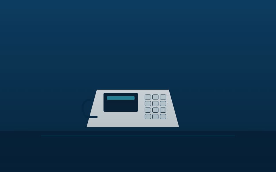IP desk phone on a reception desk, at night
