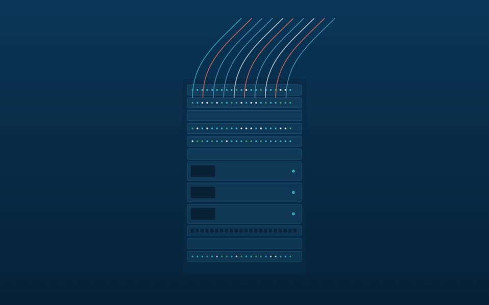 Communications rack with patch panels and switches, at night
